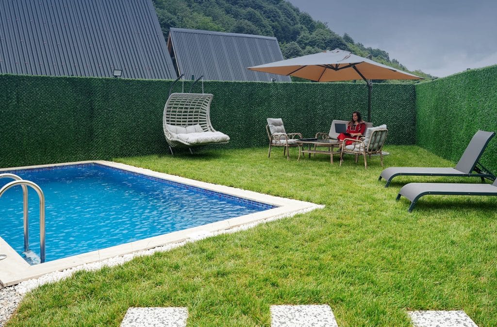 Woman working by the poolside